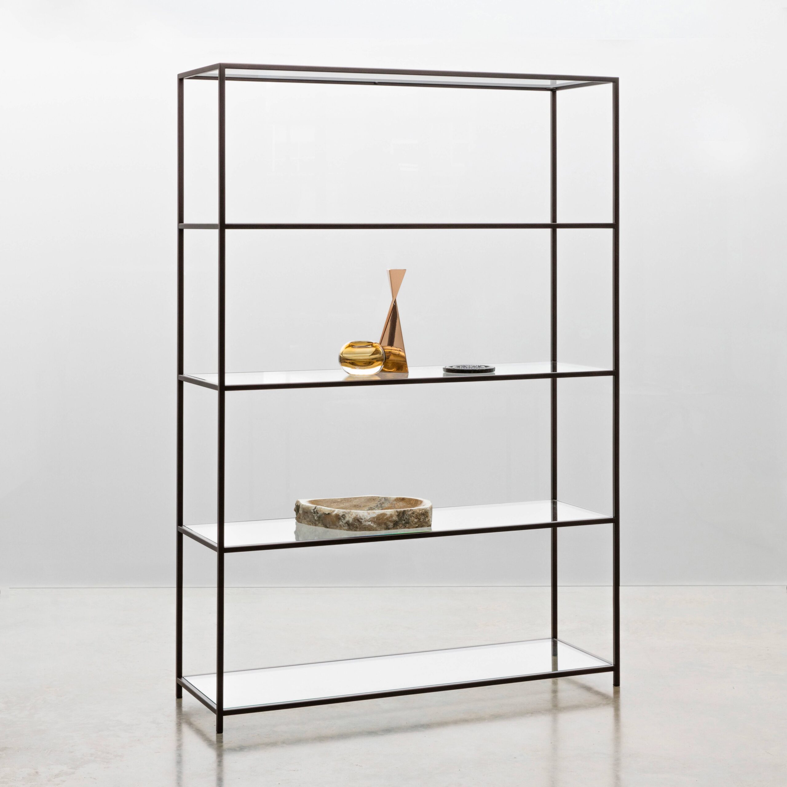 Finished in "Bronze" with clear glass shelves