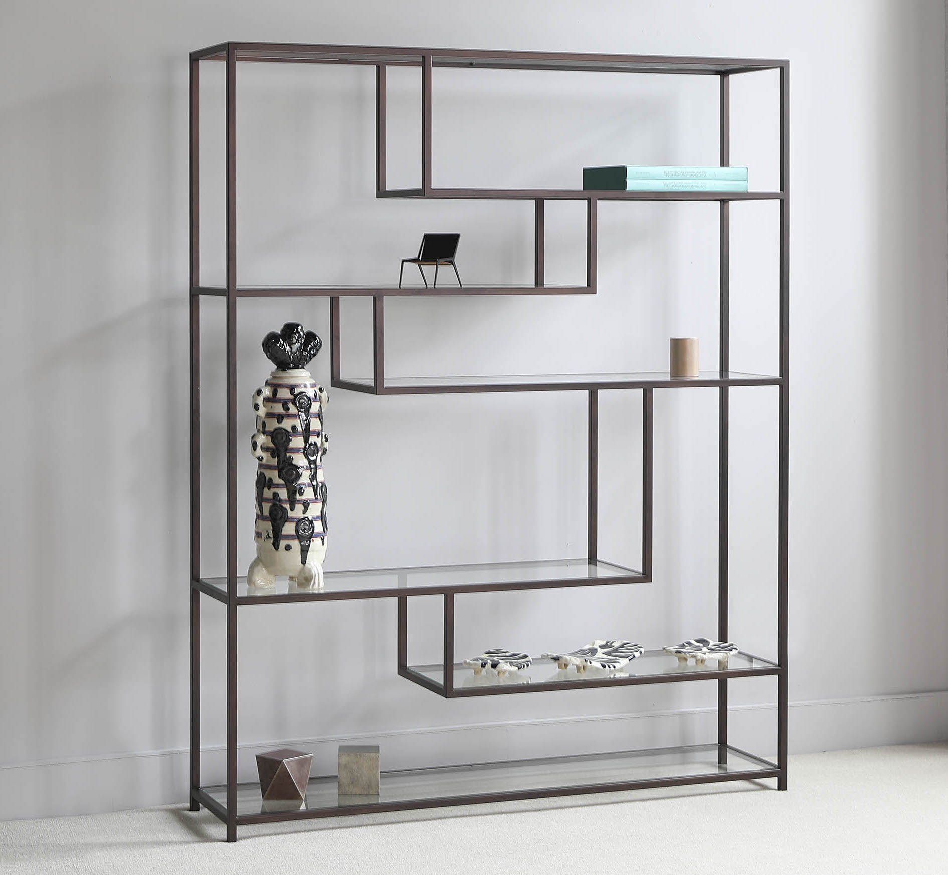 Finished in "Bronze" with clear glass shelves