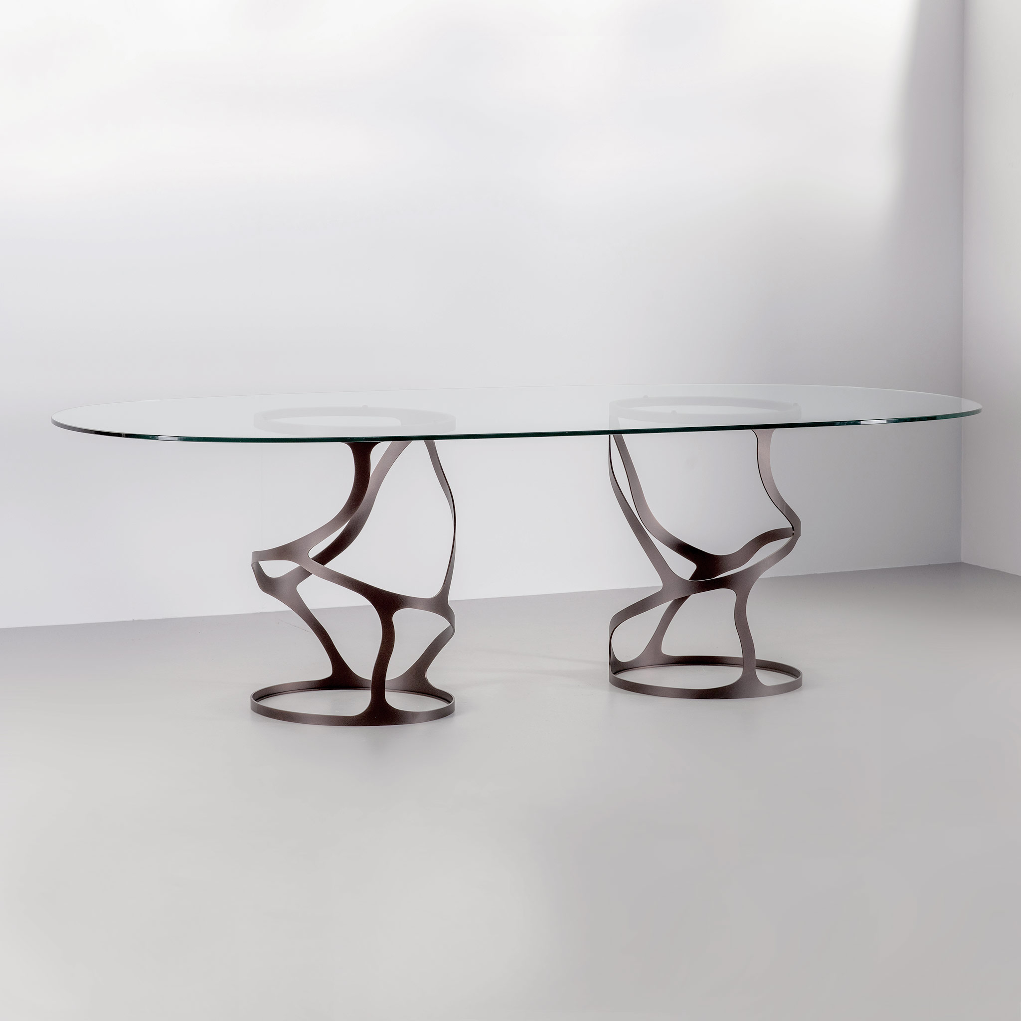 Finished in "Bronze" with a clear glass top