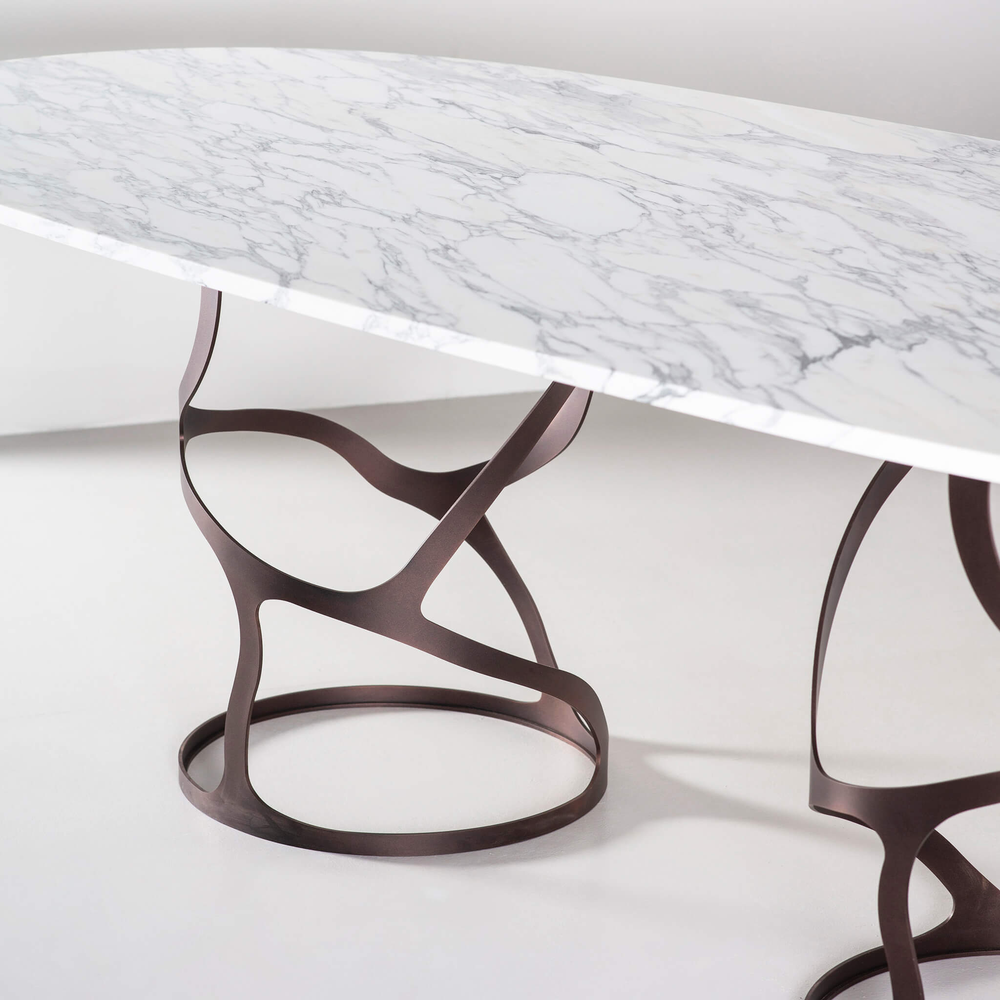 Bronze finish with Arabescato marble top